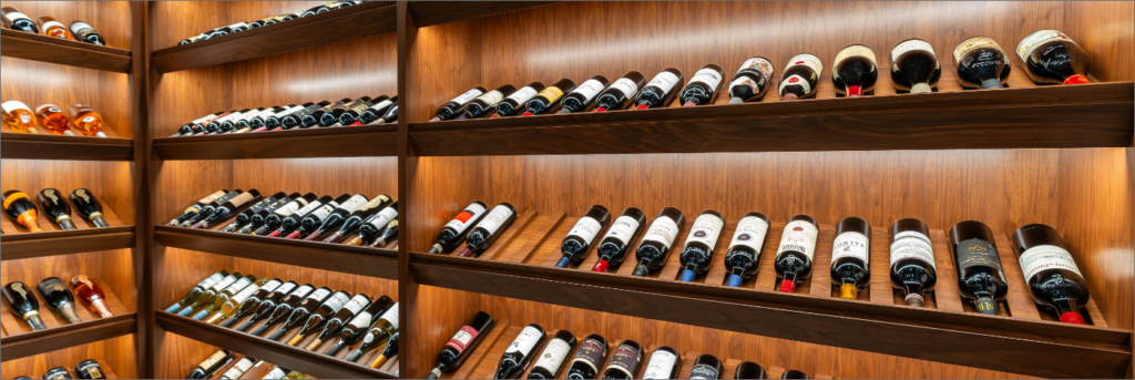 Spacious wine room can hold hundreds of bottles. Designed by Sarnia Cabinets.