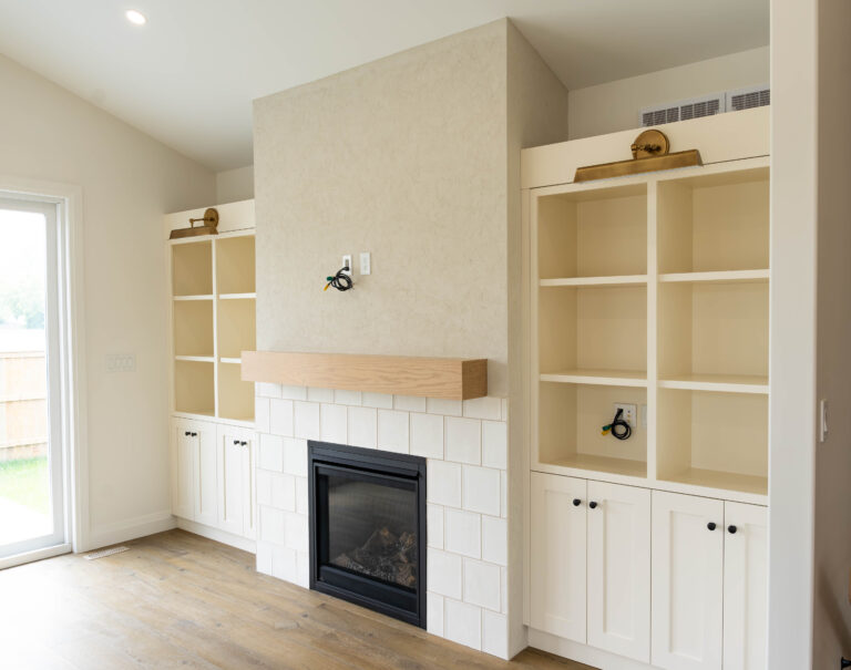 Living room built-in storage. White cabinets by Sarnia Cabinets.
